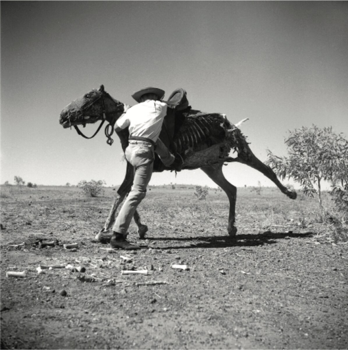Sidney Nolan, Brian the stockman at Wave Hill Station mounting a dead horse, 1952 – C-type print 2011, edition of 10. © Sidney Nolan Trust